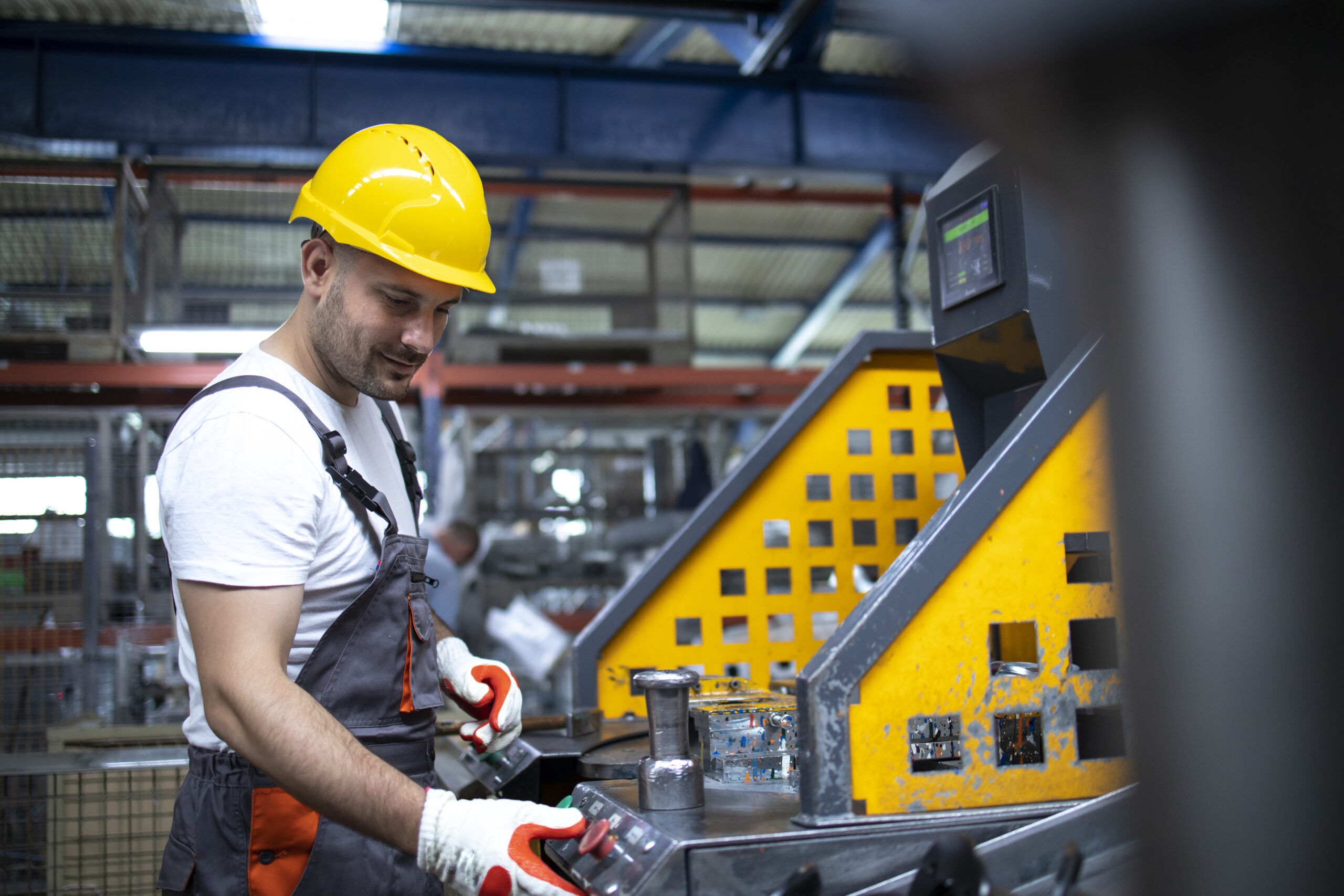 portrait factory worker working industrial machine production plant scaled.jpg